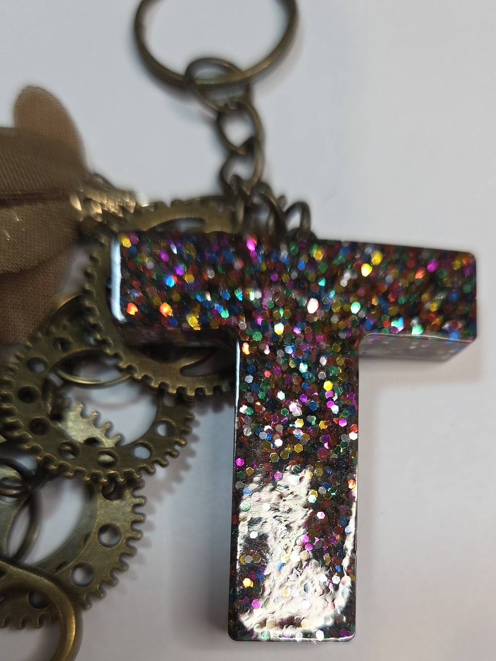 Steampunk-Inspired Brown Resin letter "T" Keychain with Gears, a Key & Tassel - Picture 5 of 9